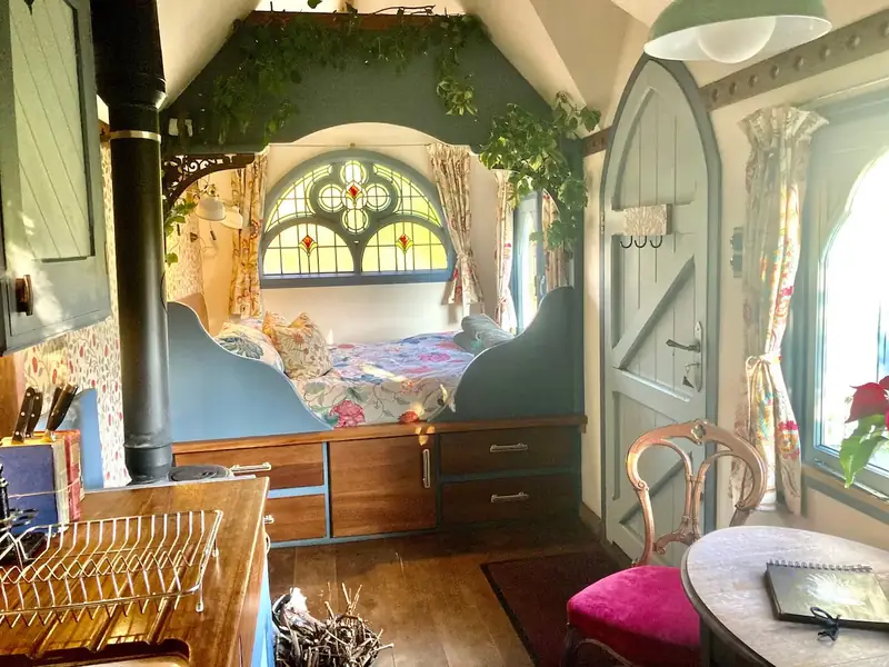 Inside The Tabernacle: the cosy double bed nestled beneath the stained glass window