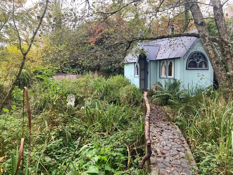A rustic bridge and stone path leading to the Tabernacle